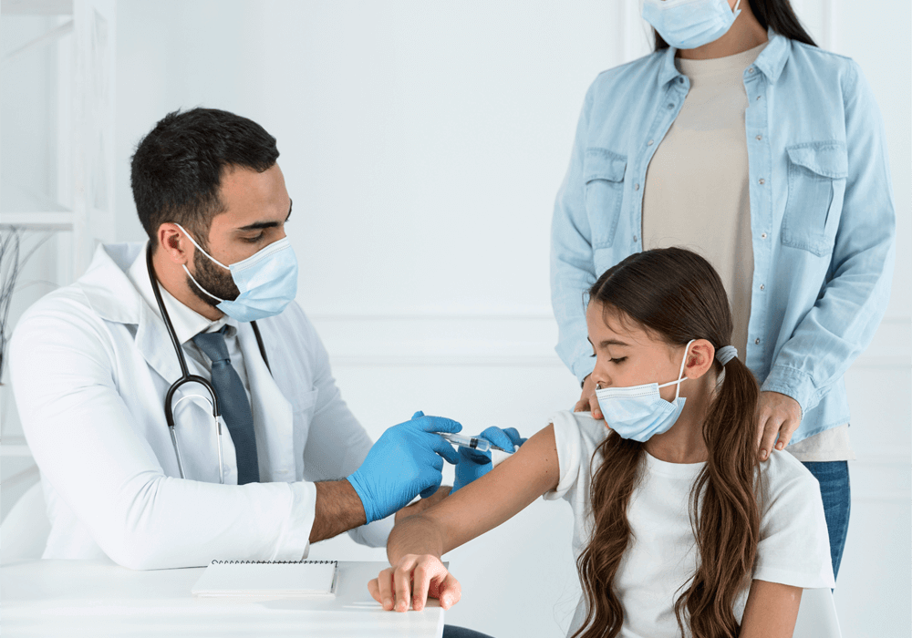 doctor-vaccinating-little-girl-that-s-supported-by-her-mothers doctor-vaccinating-little-girl-that-s-supported-by-her-mothers
