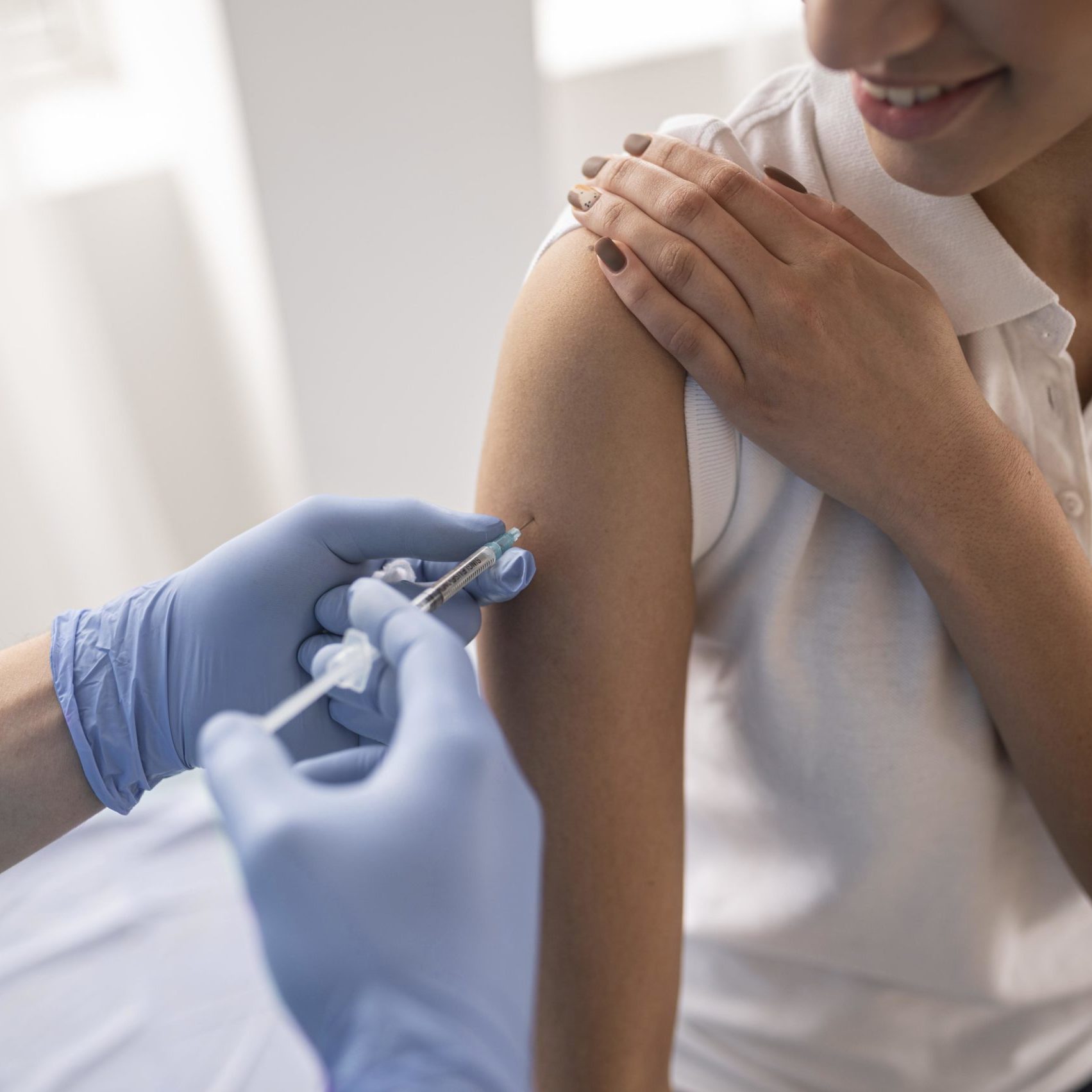 doctor-vaccinating-patient-clinic doctor-vaccinating-patient-clinic